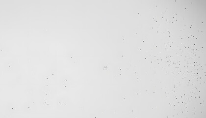 A mostly blank background with a small, centered design, like a tiny star or dot, emphasizing simplicity and space