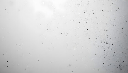 A mostly blank background with a small, centered design, like a tiny star or dot, emphasizing simplicity and space