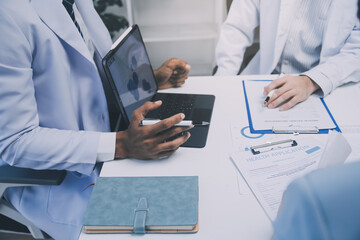 Meeting, tablet and team of doctors with collaboration for healthcare talk and telehealth app in...