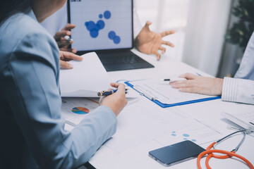 Meeting, tablet and team of doctors with collaboration for healthcare talk and telehealth app in office. Surgeon group, tech and medical discussion with website for hospital funding or sponsorship