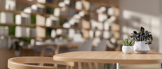 A product display space on a minimalist wooden table in a cozy, contemporary coffee shop or library.