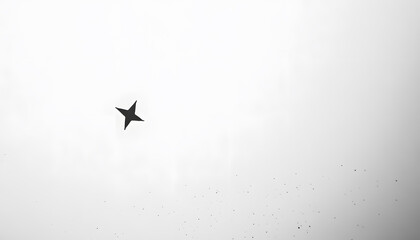 Obraz premium A mostly blank background with a small, centered design, like a tiny star or dot, emphasizing simplicity and space