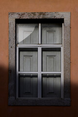 Reflections on a building window in Lisbon, Portugal