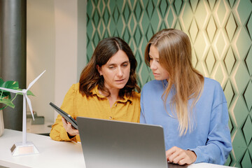 young female business people working in modern office