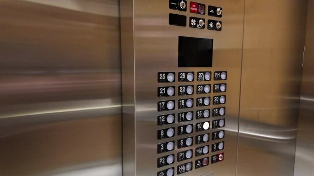 Woman tapping and pressing the ten button inside the elevator with 4k resolution