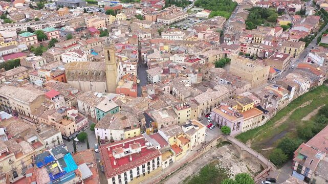 Summer view from drone of center of medieval Spanish town of La Bisbal d Emporda with episcopal palace castle and Church of Santa Maria, province of Girona, Catalonia