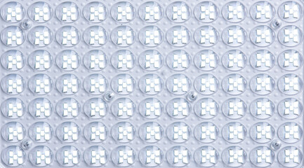 White LED panel with yellow light on background, top view, close up