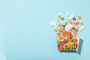 Colorful cornflakes, concept of tasty breakfast, morning food, space for text