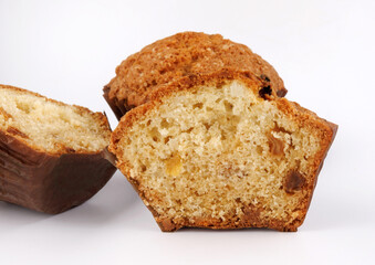 Whole and half muffin on a white background.