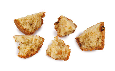 Muffin crumbled into pieces isolated on a white background.