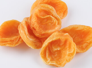 Sugar dried apricots on a white background.