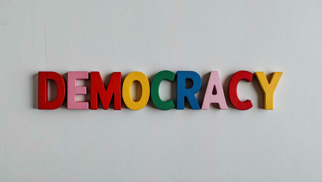 democracy word colorful wooden letters on plain white background