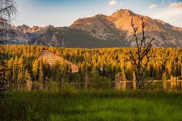 Obraz premium Mountain lake Strbske pleso. Strbske lake with view of the High Tatras National Park, Slovakia