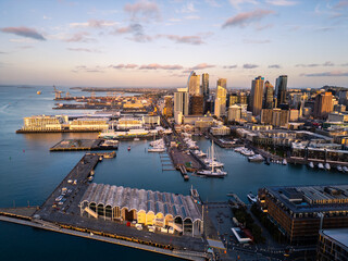 Auckland, New Zealand: Aerial view of the sunset over the Viaduct marina in the newly redeveloped wynyard district with Auckland business district skyline in New Zealand largest city