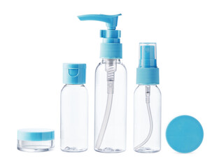 Clear plastic bottles with blue pumps and spray tops arranged on a white background