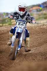 Motorcross, dirt road and athlete riding bike with speed for a race or sports competition....