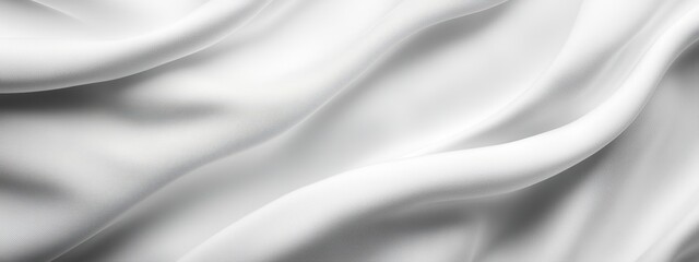 Fototapeta premium A soft, blurry black-and-white image of a flowing white drapery against a dark, monochromatic backdrop