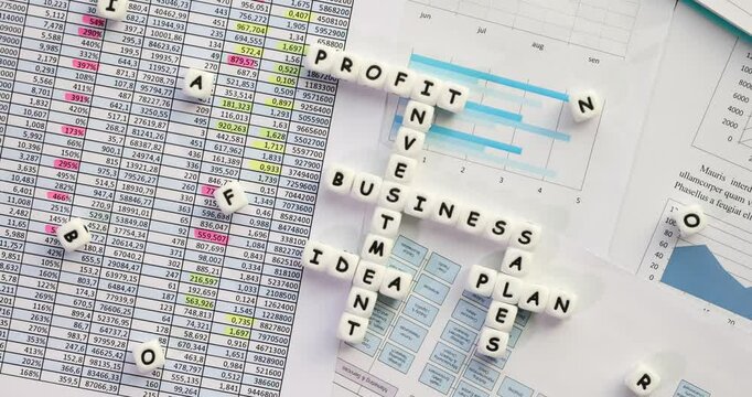 Business plan crossword with financial data diagrams