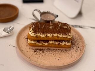 tiramisu cake in ceramic plate