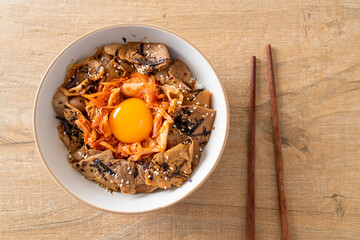 pork bulgogi rice bowl with kimchi and Korean pickled egg