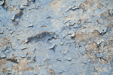 Peeling paint on wall texture. Pattern of rustic blue grunge material.