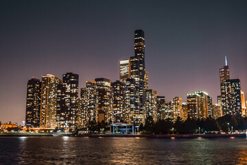 Fototapeta premium City skyline at night over a lake