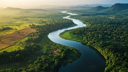 Obraz premium Bird's-eye view of the meandering Mahaweli River, flowing through lush forests and farmlands