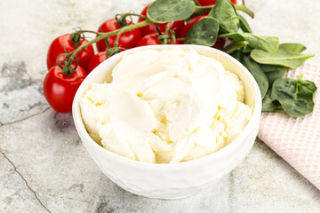 Soft cream cheese in the bowl