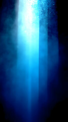 Fototapeta premium Abstract blue background with light rays and particles.