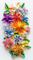 Obraz premium Artfully arranged vibrant origami flowers in various shapes and colors create a cheerful decoration on a light surface