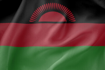 Fototapeta premium Malawi waving flag close up fabric texture background