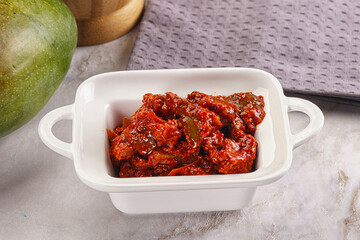 Spicy pickled raw green mango