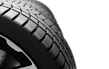 Close-up view of car tire tread on high-end wheel isolated