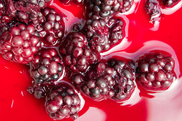 Ripe Blackberries in red juice