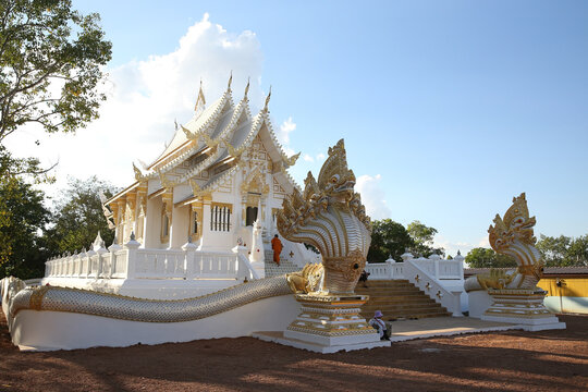 Wat Kamchanod: Buddhist temple in Udon Thani city, Thailand. Religious traditional national Thai architecture. Landmark, people, monk