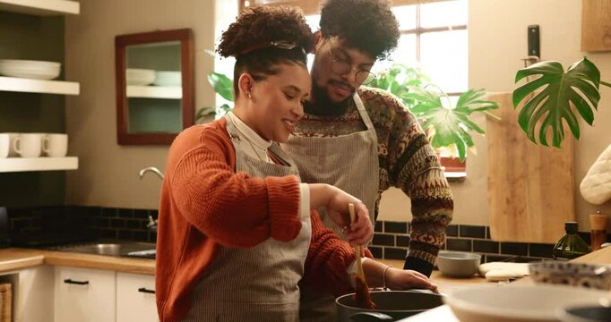 Couple, kitchen and cooking with kiss in home for support, bonding and prepare healthy meal. People, romance and food for nutrition, dinner and helping hand with conversation, love and care in house