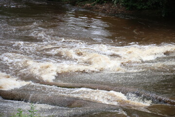 water flowing into the river