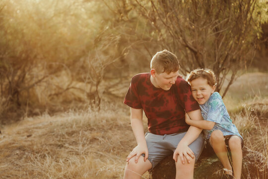 Big and little brother mucking around in the Australian bush