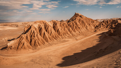 Vast, sculpted mountains characterize the arid landscape of Cordillera del Sal, showcasing striking...