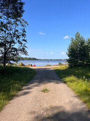 path to wooden fishing boats on the lake