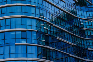 Modern glass facade of urban office building