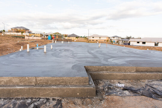 cement house slab with plumbing in place for a new house build