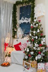 Christmas and New year decorations. Fir tree with red white bulbs, white chair and cushions, wrapped presents and mandarins
