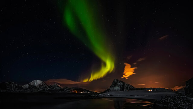 Green Northern lights over coastal mountain landscape, Stor Sandnes, Flakstad, Lofoten, Lofoten and Vesteral Islands, Nordland, Norway