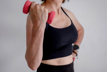 Woman'S Hand With Dumbbells Close-Up Doing Bicep Exercise