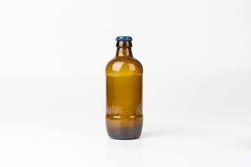 Centered brown glass beer bottle against a white background, horizontal orientation, highlighting simplicity and minimalism in the product shot