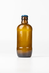 Brown Glass Beer Bottle Centered Against White Background in Vertical Orientation