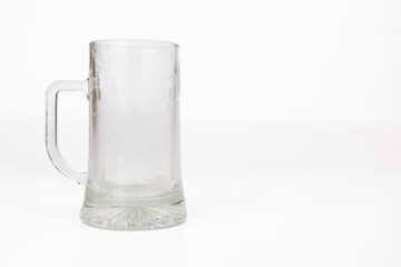 Frosted Empty Beer Mug Centered Against White Background in Horizontal Format Ideal for Stock Photography with Focus on Refreshing Concepts