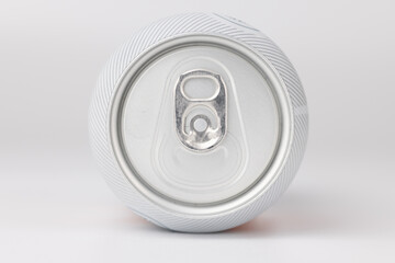 Close-up of a tilted beer can with detailed focus on the opening against a white background
