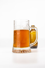 Chilled Amber Beer Jug with Empty Bottle in Background
